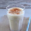 Pineapple cinnamon milkshake on a glass cup