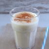 Pineapple cinnamon milkshake on a glass cup