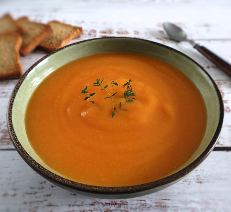 Carrot soup on a soup bowl