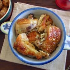 Chicken with golden potatoes on a tureen