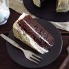 Slice of chocolate cake with chantilly on a dish