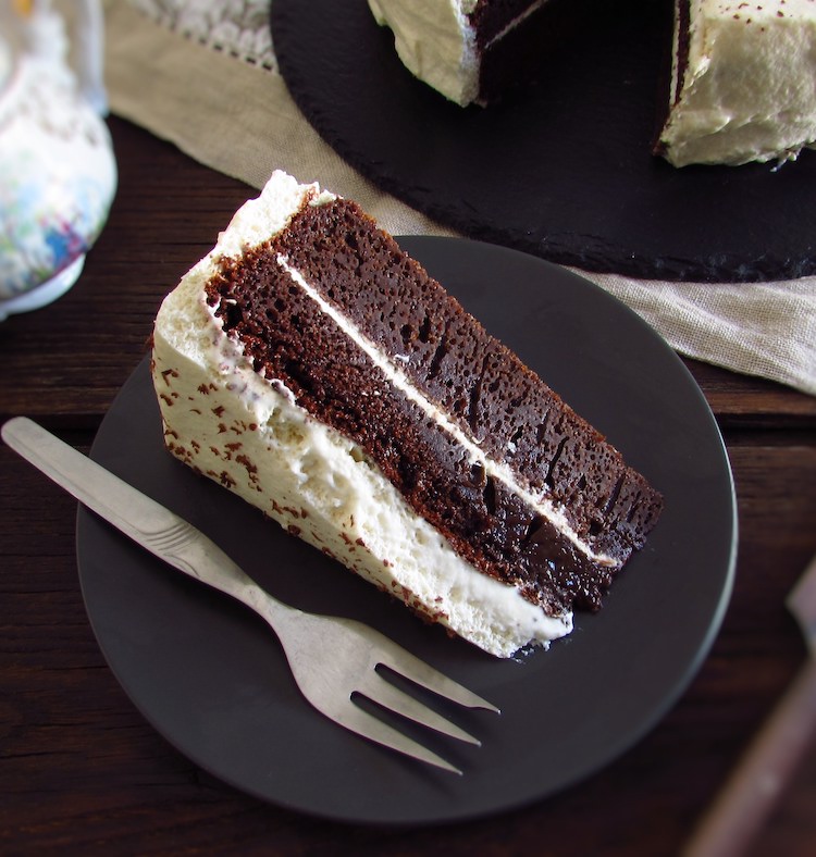 Slice of chocolate cake with chantilly on a dish