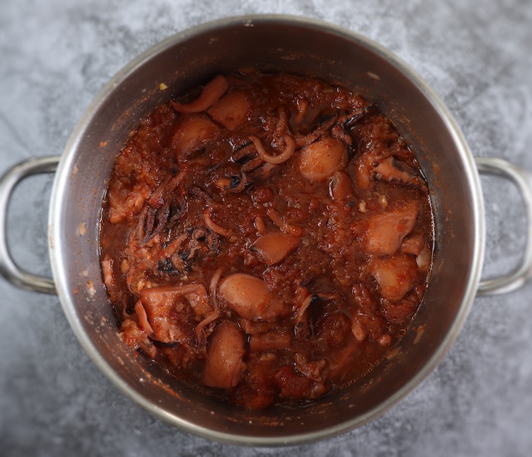 Cuttlefish stew on a large saucepan