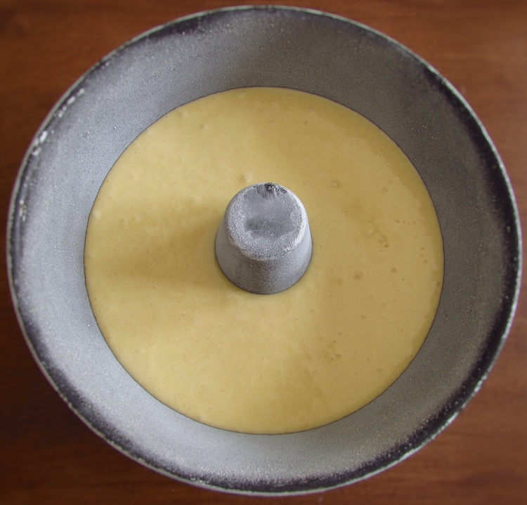 Golden cake dough on a bundt cake pan