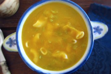 Green bean soup on a soup bowl