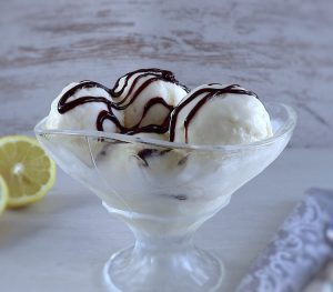 Lemon ice cream on a glass bowl