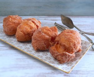Portuguese orange doughnuts on a platter