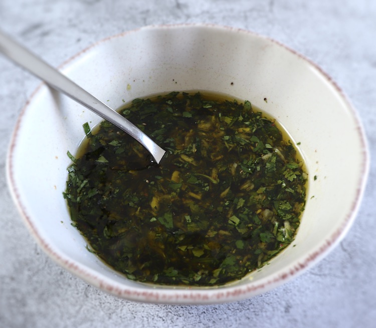 Olive oil and coriander mixture on a dish bowl