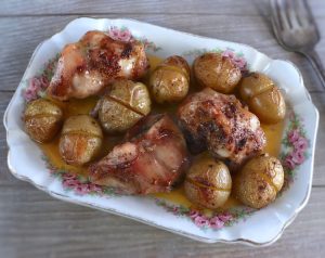 Roasted rabbit with potatoes on a platter