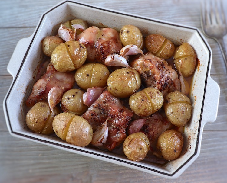 Roasted rabbit with potatoes on a baking dish