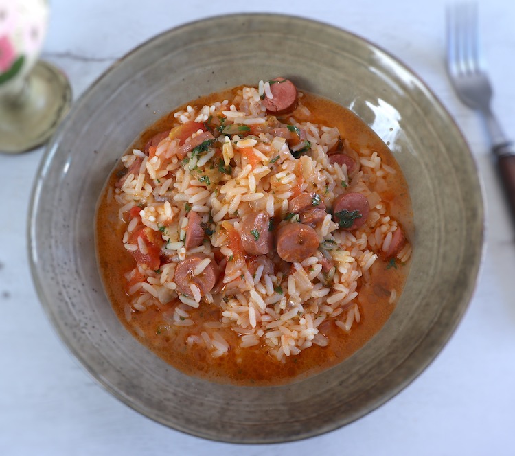 Rice with sausages on a dish bowl