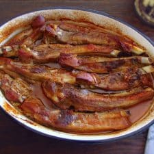 Roast spare ribs in the oven on a baking dish