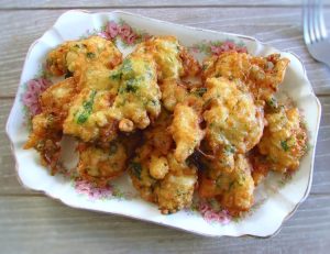 Portuguese salt cod fritters on a serving plate
