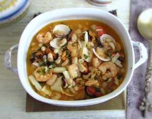 Seafood with white beans on a tureen