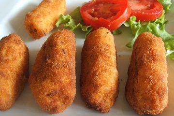 Shrimp and ham croquettes on a plate with salad