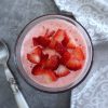 Strawberry ice cream on a glass bowl