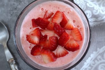 Strawberry ice cream on a glass bowl