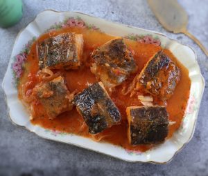 Salt cod in tomato sauce on a platter