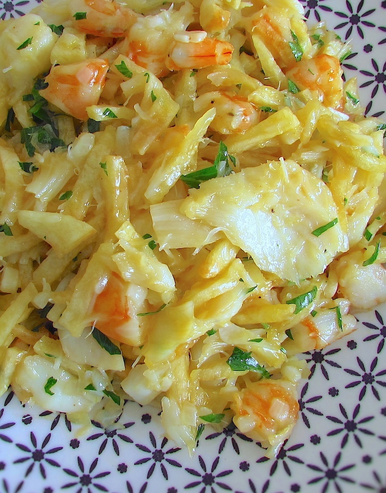 Salt cod, potatoes, eggs and shrimp on a plate