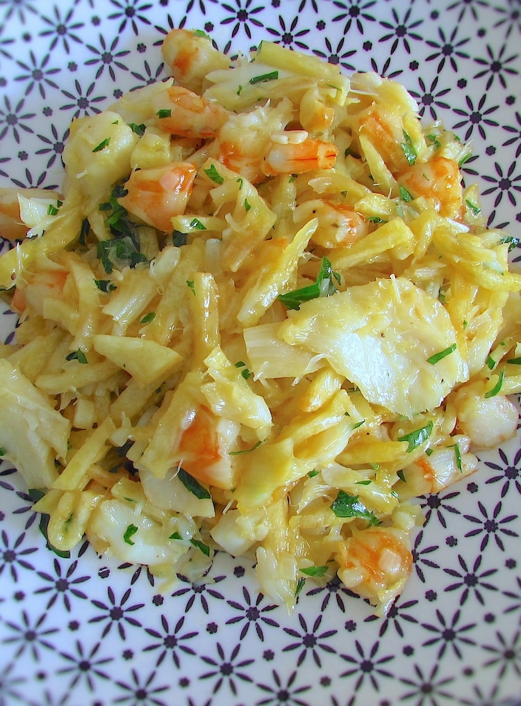 Salt cod, potatoes, eggs and shrimp on a plate