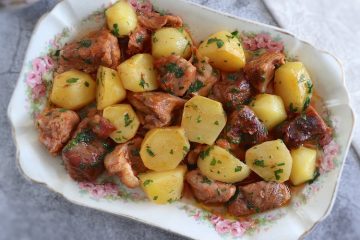 Baked pork with potatoes on a platter
