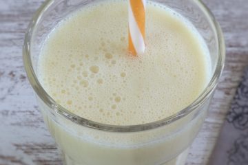 Pineapple milkshake on a glass cup