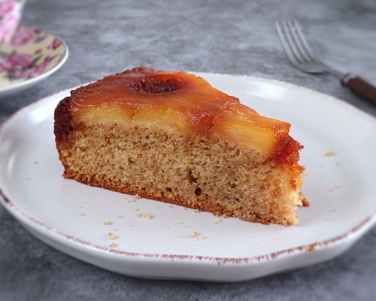 Slice of pineapple upside down cake on a plate