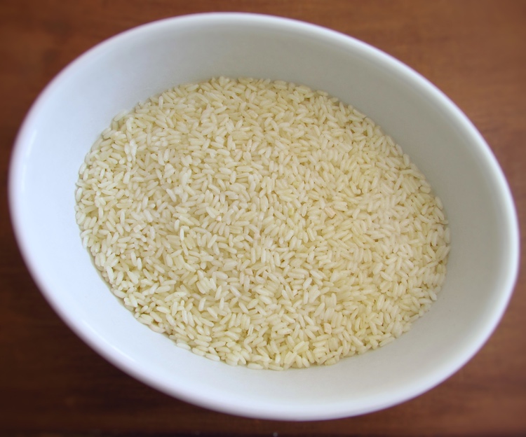 A layer of rice on a baking dish