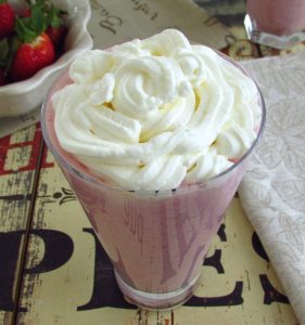 Strawberry milkshake on a glass cup