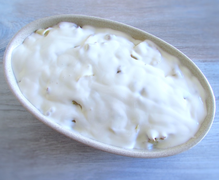 Meat and pasta with béchamel sauce on a baking dish