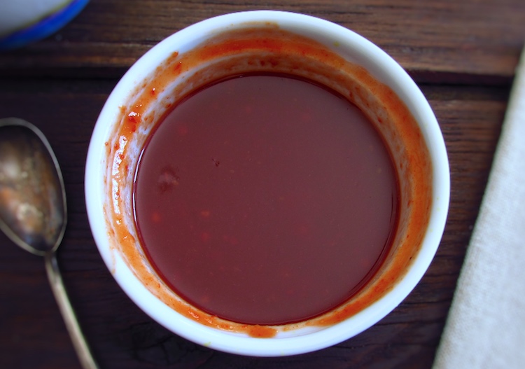 Mixture of red pepper sauce, honey, mustard and Worcestershire sauce in a bowl