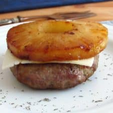 Hamburger with pineapple on a plate