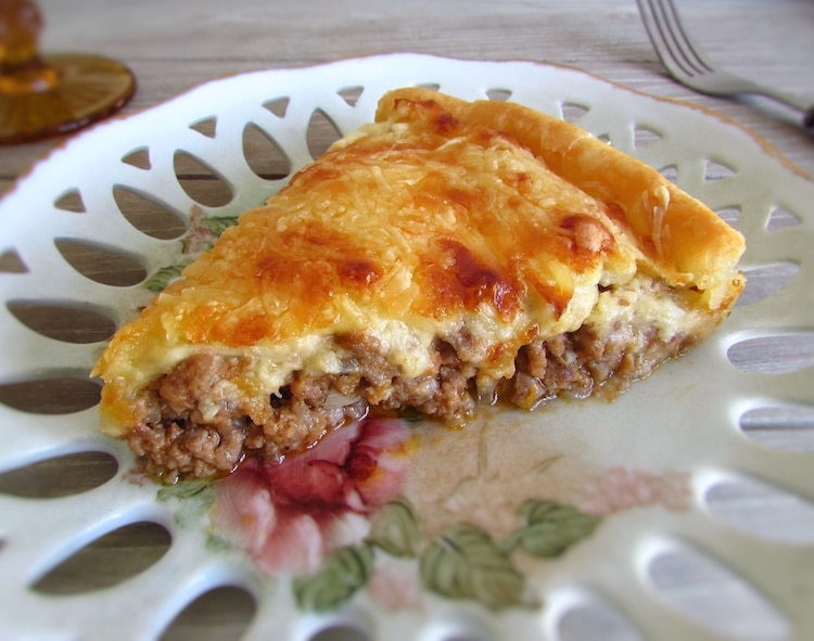 Meat pie slice on a plate