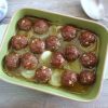 Baked meatballs on a baking dish