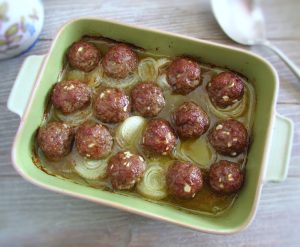 Baked meatballs on a baking dish