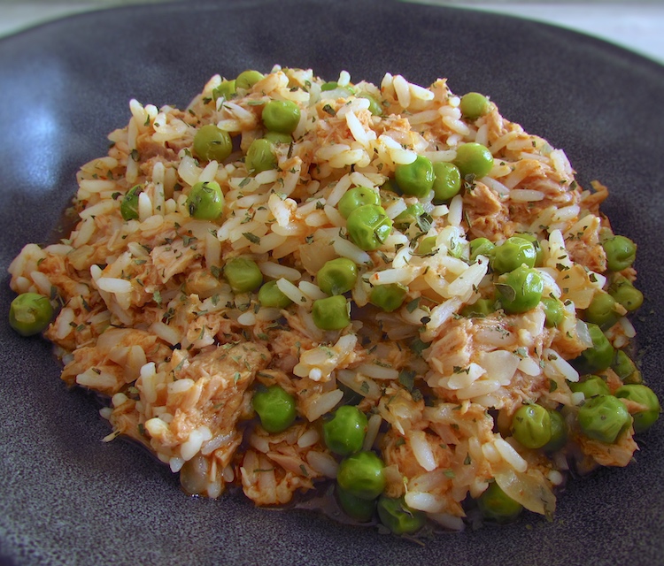 Rice with tuna and peas on a dish bowl