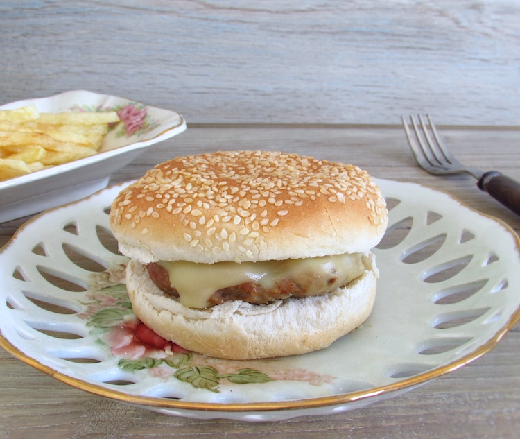Simple burgers with bread and cheese on a dish