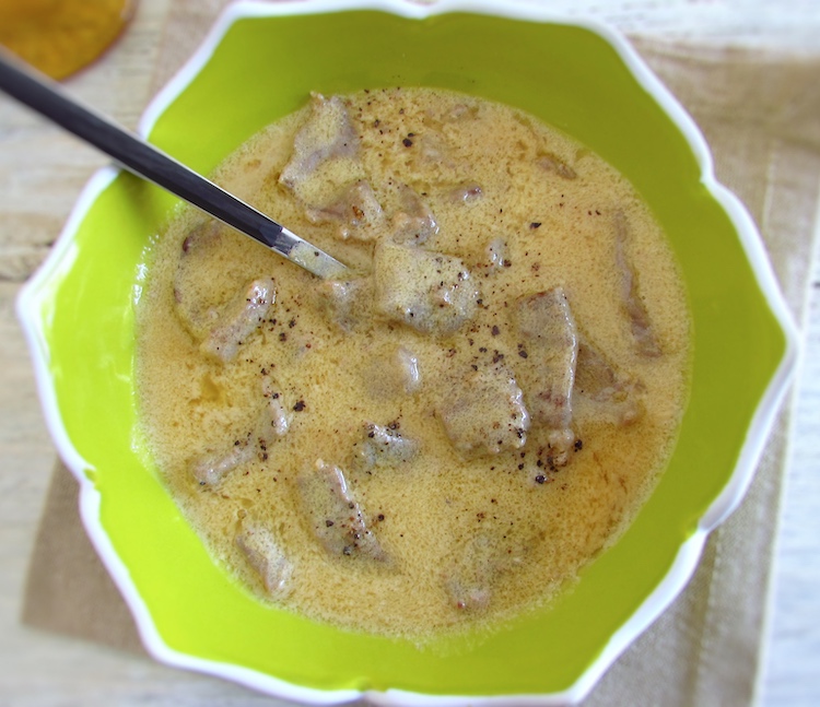 Steaks with lemon sauce on a dish bowl