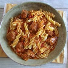 Stewed beef with pasta on a dish bowl