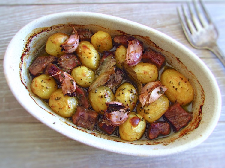 Roasted veal cubes with potatoes on a baking dish