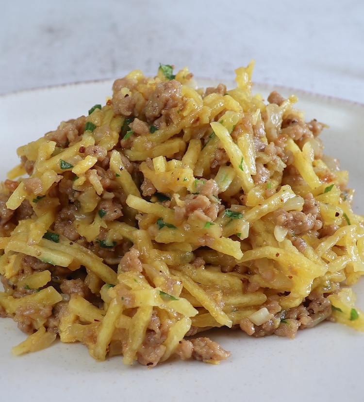 Ground meat, potatoes and eggs on a plate