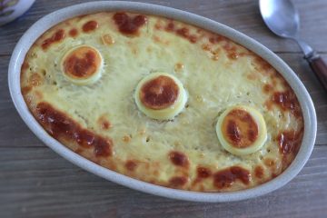 Baked rice with meat and egg on a baking dish