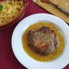 Pork chops with honey mustard sauce on a plate