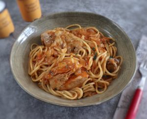Chicken stew with spaghetti on a bowl