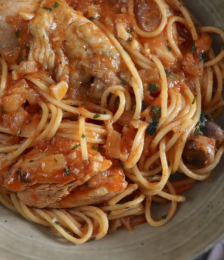 Chicken stew with spaghetti on a dish bowl