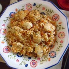 Fried chicken breast with tomato rice on a dish bowl
