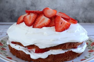 Strawberry cream cake on a serving plate