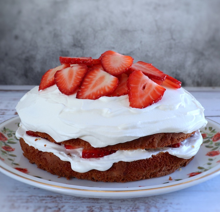 Strawberry cream cake on a serving plate