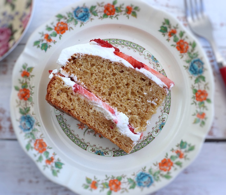 Slice of strawberry cream cake on a plate