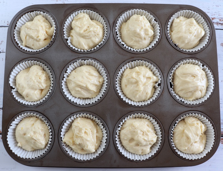 Lemon muffins dough on paper liners